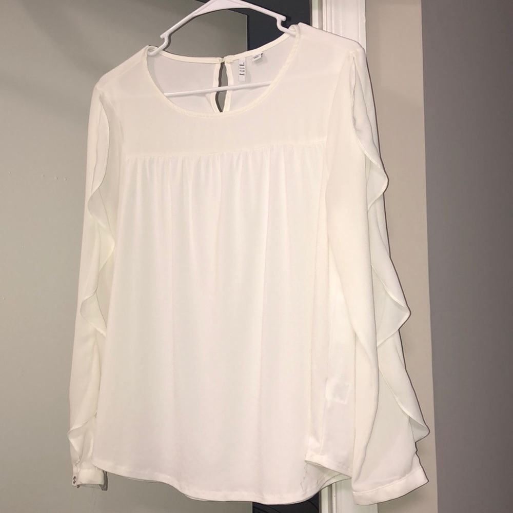 White ruffled blouse